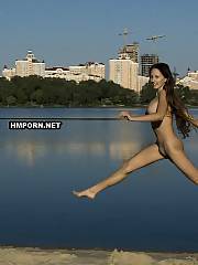 Nudist and naturist babes jumping naked on the beach and spreading legs in the air flashing their sweet pussies