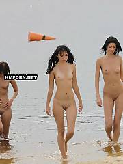 Naked beach chicks exposing superb bodies on the beach and flashing beautiful pussies for buddies and strangers walking around