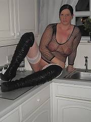 Thick bitch mother trying to be hot in a see-thru outfit and big boots. i guess everyones definition of hot is different.