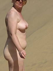 My mother showing off her body on the beach, shes not super fit but not super bbw either