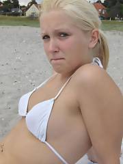 lighthaired teenager spreads ass