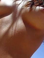 Outdoor amateur teen babe self shooting herself naked on a public beach.