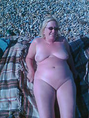 My sexy wifey naked on the beach...wife just loves to sunbathe naked...and loves mates getting off on her