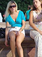 Hot amateur girls and horny mature women flash panties upskirt, spread legs in public to show nude pussy underskirt