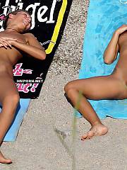 nudist couples beach spreading