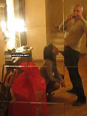 Women taking selfie banging photos in front of the mirrors at home with husbands